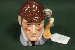 ROYAL DOULTON NOT FOR RESALE CHARACTER JUG - THE SLEUTH, having a blue coat and brown hat, 'The