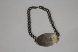 A WORLD WAR II SILVER ID BRACELET