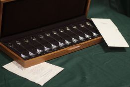 A BOXED SET OF TWELVE HALLMARKED SILVER RSPB SPOONS WITH CERTIFICATE