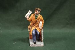 A ROYAL DOULTON 'THE NEWS VENDOR' FIGURE HN 2891