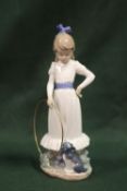A NAO FIGURE OF A GIRL WITH A HOOLA HOOP