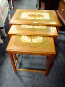 A RETRO TEAK NEST OF TILE TOP TABLES