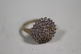 A 9K GOLD DRESS RING SET WITH LILAC COLOURED STONES (ONE STONE MISSING) SIZE - Q APPROX WEIGHT - 4.