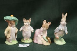 FOUR GOLD STAMPED BESWICK BEATRIX POTTER FIGURES COMPRISING OF PETER RABBIT, HUNCA MUNCA SWEEPING,