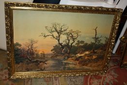 A LARGE GILT FRAMED LANDSCAPE PRINT