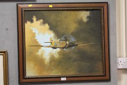 A FRAMED OIL ON BOARD OF A SPITFIRE SIGNED T CAINE LOWER RIGHT