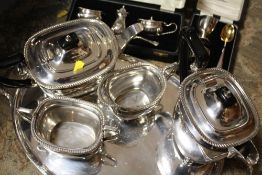 A SILVER PLATED FOUR PIECE TEA SERVICE ON TWIN HANDLED SERVING TRAY, TOGETHER WITH A CASED