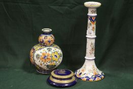 A 20TH CENTURY FRENCH FAIENCE POTTERY CANDLESTICK, H 37 cm, together with a Poly Delft double