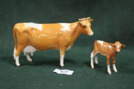 A BESWICK GUERNSEY COW AND CALF - BOTH A/F
