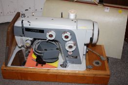 A CASED VINTAGE JONES SEWING MACHINE