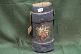 AN ANTIQUE LEATHER GORDITE SHELL CARRIER AMMUNITION CASE DECORATED WITH A COAT OF ARMS