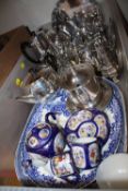 A BOX OF SILVER PLATED METALWARE, BLUE AND WHITE MEAT PLATES ETC.