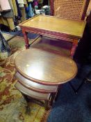 A REPRODUCTION OAK SERVING TROLLEY AND NEST OF TABLES