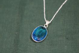 A STERLING SILVER AND BLUE TOPAZ PENDANT ON CHAIN