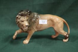 A BESWICK GLOSS FINISH FIGURE OF A LION