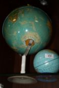 A DESK TOP GLOBE, TOGETHER WITH A GLOBE SHAPED MONEY BOX (2)