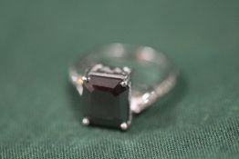 A STERLING SILVER AND BLACK DIAMOND STYLE DRESS RING