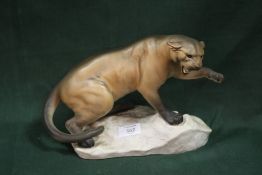 A BESWICK MATTE FINISH FIGURE OF A PUMA ON A ROCK