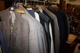 A RAIL OF VINTAGE GENTS CLOTHING, various styles and periods including two piece suits, 3pc