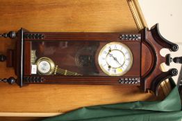 A REPRODUCTION MAHOGANY TEMPUS WALL CLOCK
