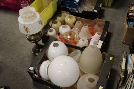 A BRASS OIL LAMP TOGETHER WITH TWO TRAYS OF GLASS LAMP SHADES