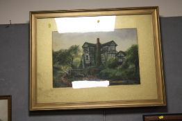 A LARGE GILT FRAMED AND GLAZED WATERCOLOUR OF A TUDOR COUNTRY HOUSE BY A RIVER SIGNED JOHN THORLEY