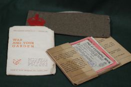A SMALL QUANTITY OF WARTIME EPHEMERA TO INCLUDE RATION BOOKS, WAR GARDENING LEAFLET ETC.