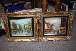 A PAIR OF GILT FRAMED OILS ON BOARD DEPICTING STREET SCENES