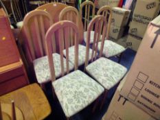 A MODERN CIRCULAR DINING TABLE AND SIX CHAIRS