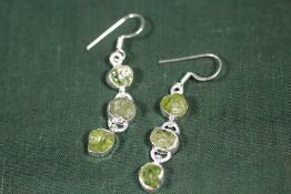 A PAIR OF STERLING SILVER AND PERIDOT EARRINGS