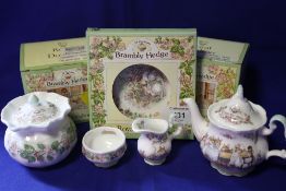 A BOXED ROYAL DOULTON BRAMBLY HEDGE MINIATURE THREE PIECE TEA SERVICE TOGETHER WITH A SUGAR BOWL AND