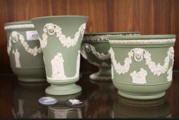 FOUR LARGE PIECES OF GREEN WEDGWOOD JASPERWARE TO INCLUDE A FOOTED BOWL, LARGE PLANTER ETC. TOGETHER