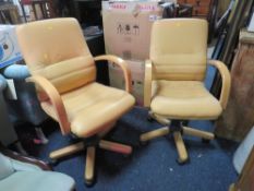 A PAIR OF MODERN OFFICE SWIVEL ARMCHAIRS
