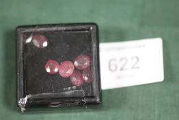SEVEN ASSORTED RUBY TYPE STONES