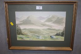 A FRAMED AND GLAZED WATERCOLOUR OF A HILLSIDE SCENE