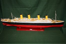 A HAND BUILT WOODEN MODEL OF THE TITANIC