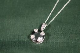 A STERLING SILVER AND BLACK DIAMOND STYLE PENDANT ON CHAIN