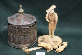 A JAPANESE IVORY OKIMONO, depicting a fisherman with two children with a fishing basket and loose