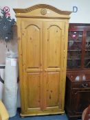 A MODERN HONEY PINE DOUBLE WARDROBE H- 214 CM W-99 CM