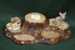 A BESWICK TREE STUMPS SHAPED DISPLAY STAND, TOGETHER WITH TWO BESWICK MOUSE FIGURES (3)