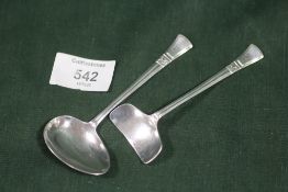 A HALLMARKED SILVER SPOON AND PUSHER SET