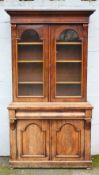 A VICTORIAN MAHOGANY GLAZED FLOORSTANDING BOOKCASE, the twin glazed door upper section with