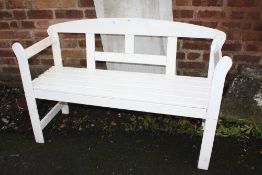A PAINTED WHITE BENCH