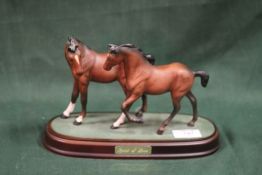 A ROYAL DOULTON MATTE FINISH SPIRIT OF LOVE FIGURE GROUP OF FOALS