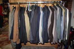 A RAIL OF VINTAGE GENTS CLOTHING, various styles and periods to include tweed style coat and