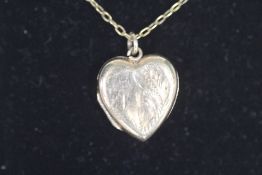 A 9CT BK & FT HEART SHAPED LOCKET