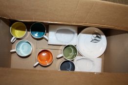 A SET OF SIX SUSIE COOPER CUPS AND SAUCERS WITH HARLEQUIN COLOURED INTERIORS