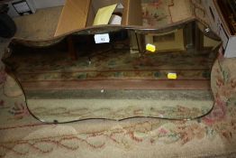 A BEVEL EDGED WALL MIRROR