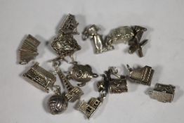 FOURTEEN SILVER BRACELET CHARMS TO INCLUDE ARTICULATED EXAMPLES