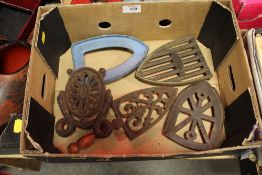 FIVE CAST IRON TRIVETS